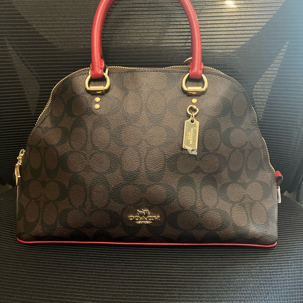 Red and brown Coach purse. 
Great condition. 
Fits phone, passport, and wallet.